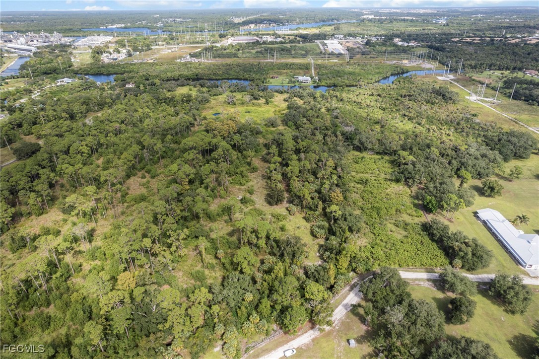 11281 Long Road Fort Myers, FL 33905 - Photo 19 of 24 an aerial view of residential houses with outdoor space and trees