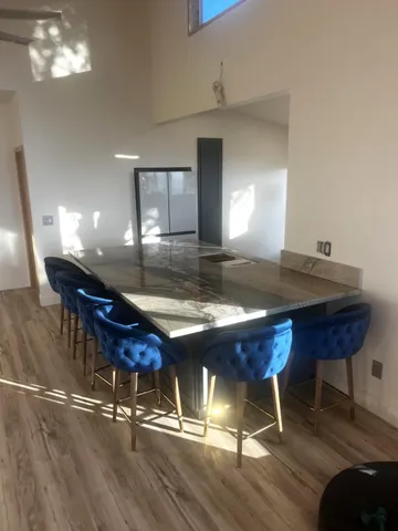 a front view of house with yard and sitting area