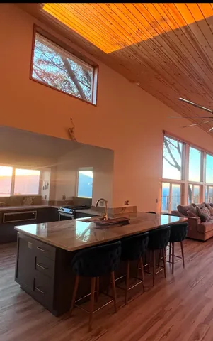 a backyard of a house with a yard and lake view