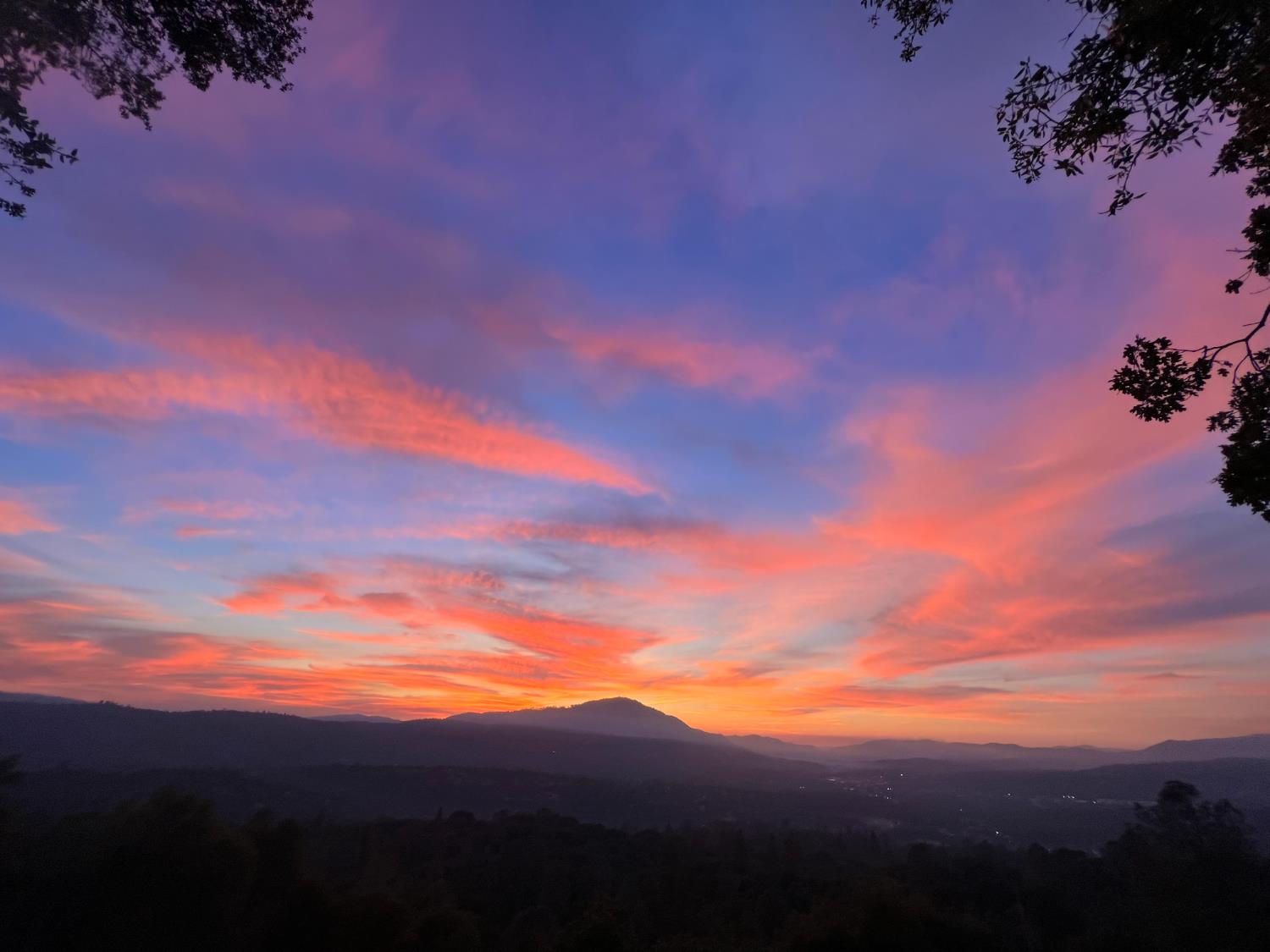 51571 Coyote Ridge Road Oakhurst, CA 93644 - Photo 29 of 81 Sunset view from Blissful Retreat covered deck.