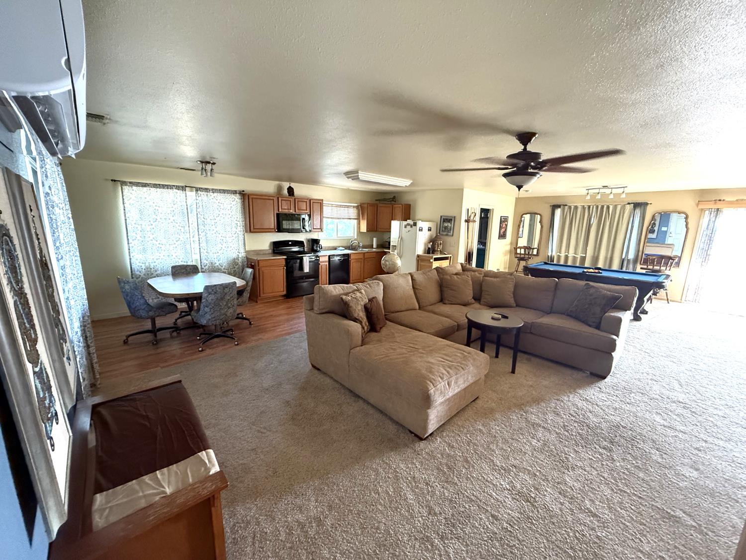 51571 Coyote Ridge Road Oakhurst, CA 93644 - Photo 34 of 81 a living room with furniture and a large window