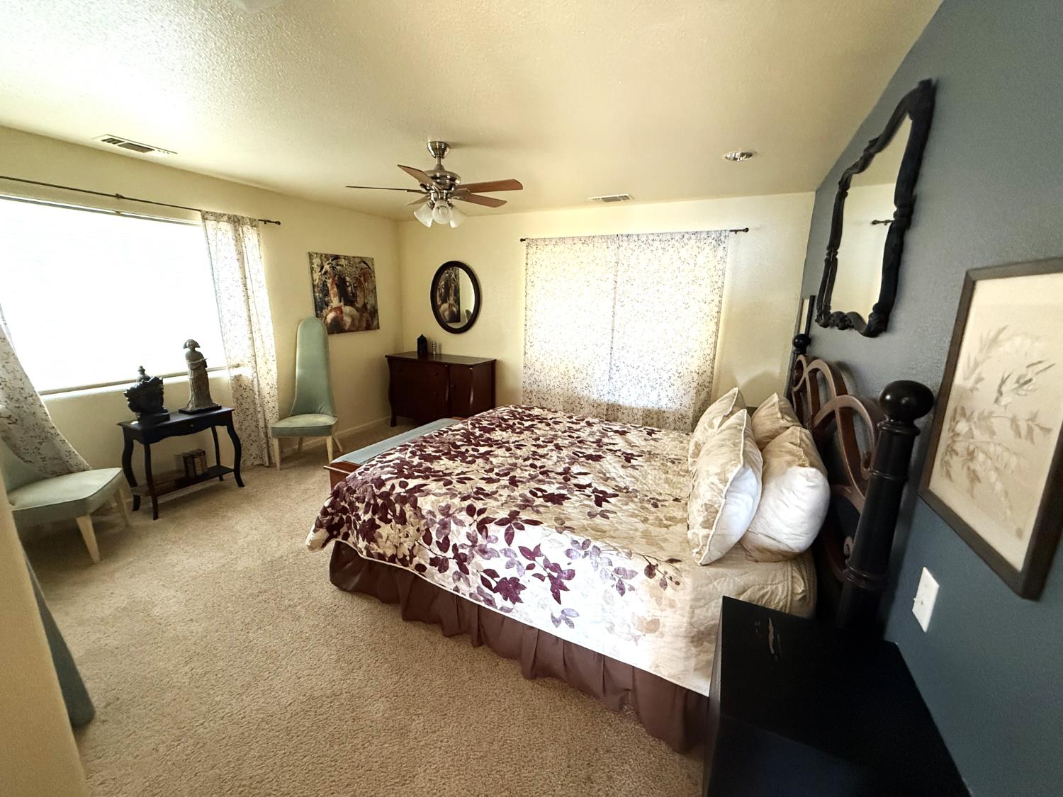 51571 Coyote Ridge Road Oakhurst, CA 93644 - Photo 37 of 81 a bedroom with a bed a dresser and window