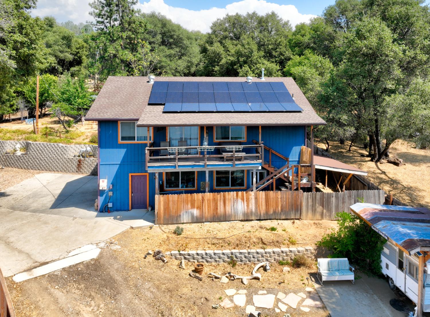 51571 Coyote Ridge Road Oakhurst, CA 93644 - Photo 43 of 81 a view of a house with wooden floor and a large pool