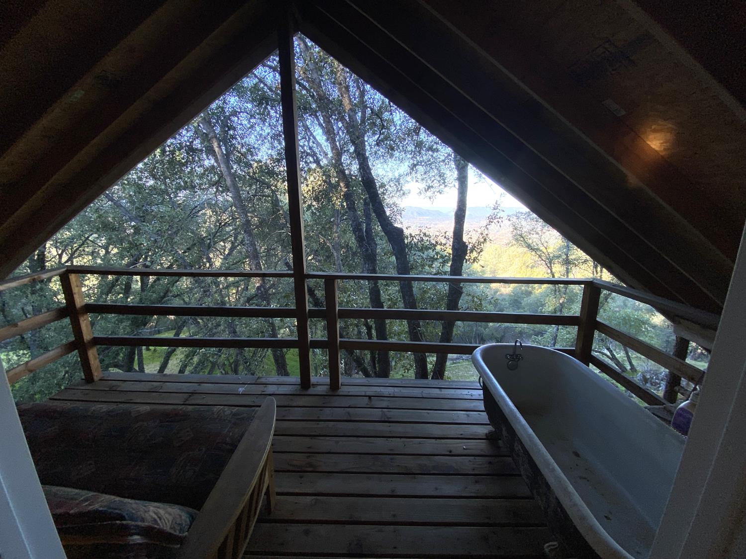 51571 Coyote Ridge Road Oakhurst, CA 93644 - Photo 56 of 81 a view of a balcony with wooden floor and outdoor seating