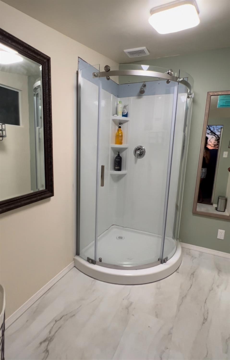 51571 Coyote Ridge Road Oakhurst, CA 93644 - Photo 66 of 81 a bathroom with a shower and mirror