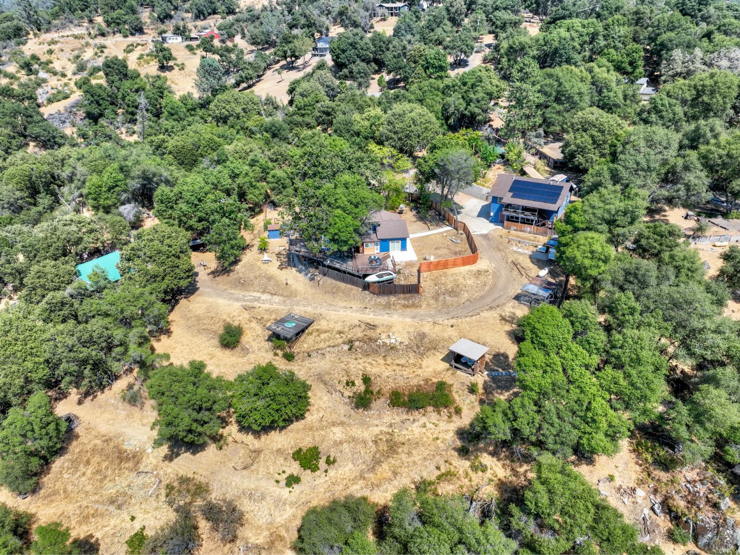 51571 Coyote Ridge Road Oakhurst, CA 93644 - Photo 79 of 81 an aerial view of a house with a yard