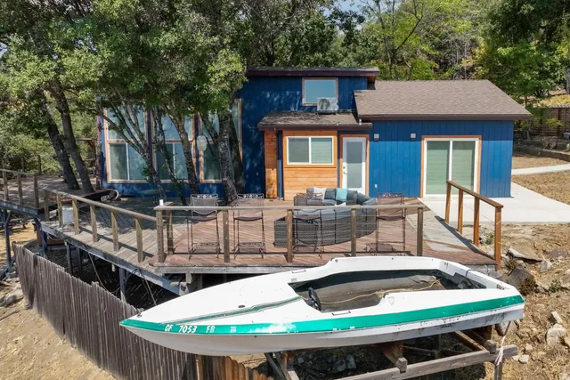 a bedroom with a bed and a mirror