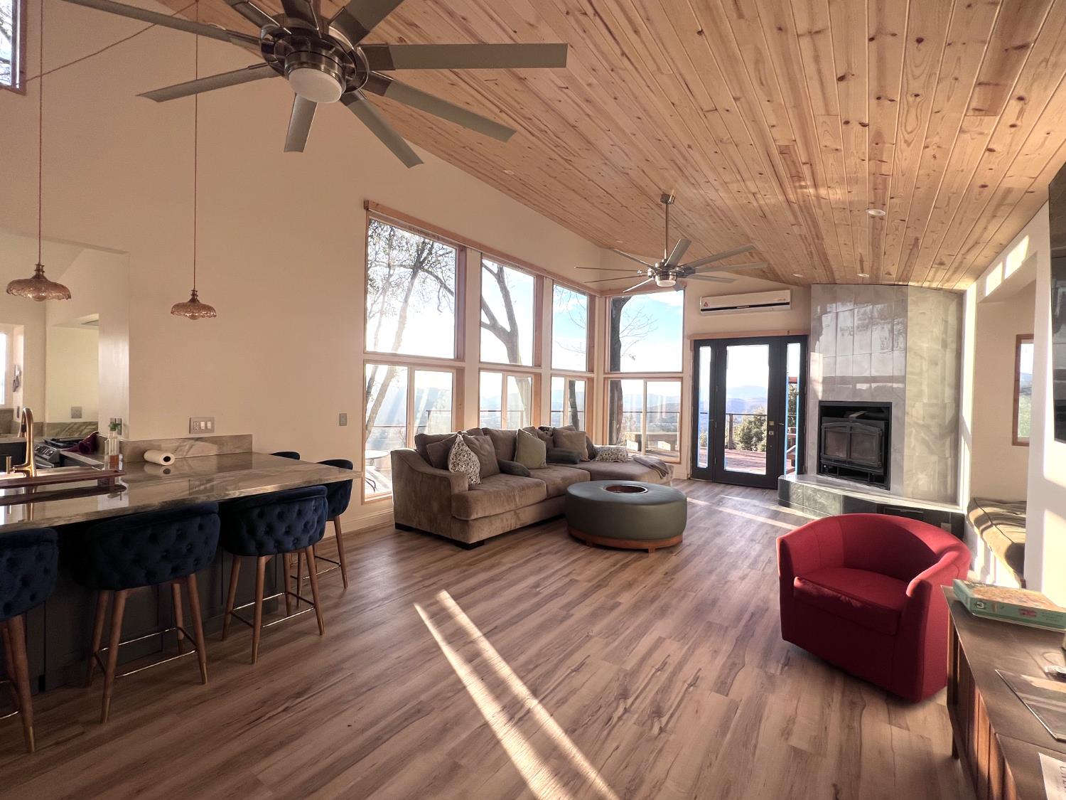 51571 Coyote Ridge Road Oakhurst, CA 93644 - Photo 10 of 81 a living room with furniture and a large window