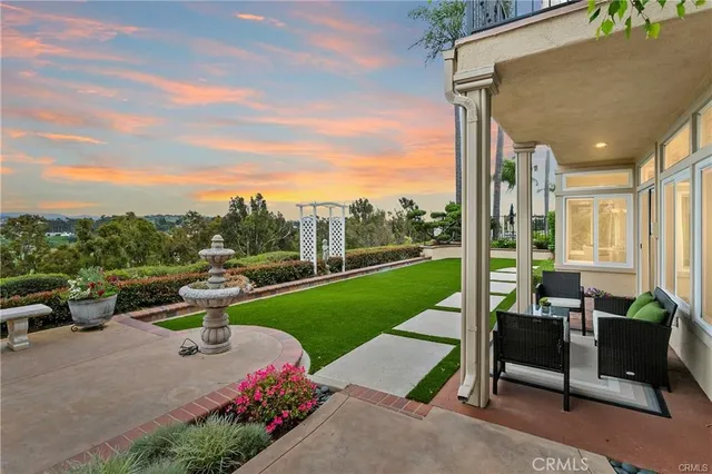 a view of a patio with table and chairs potted plants with sky view