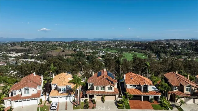 an aerial view of residential houses and city street