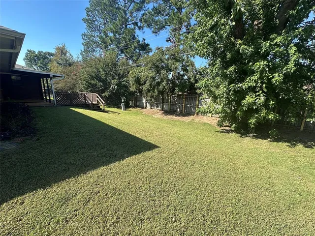 a view of a yard with an trees