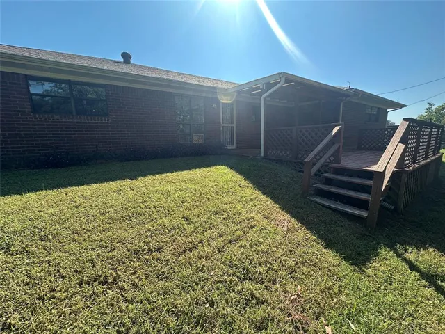 a view of a backyard of the house