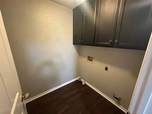 an empty room with wooden floor