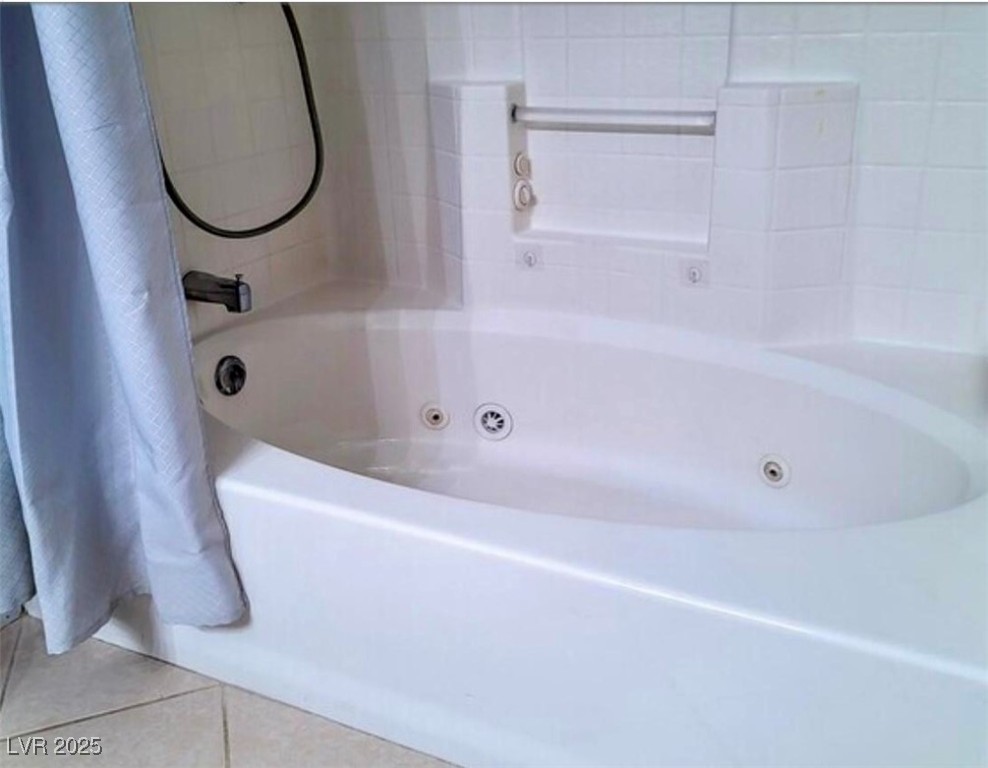 8070 West Russell Road, Unit 2094 Las Vegas, NV 89113 - Photo 14 of 19 Full bath with tile patterned floors and a combined bath / shower with jetted tub