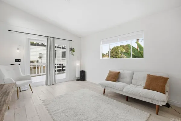a living room with furniture and a rug
