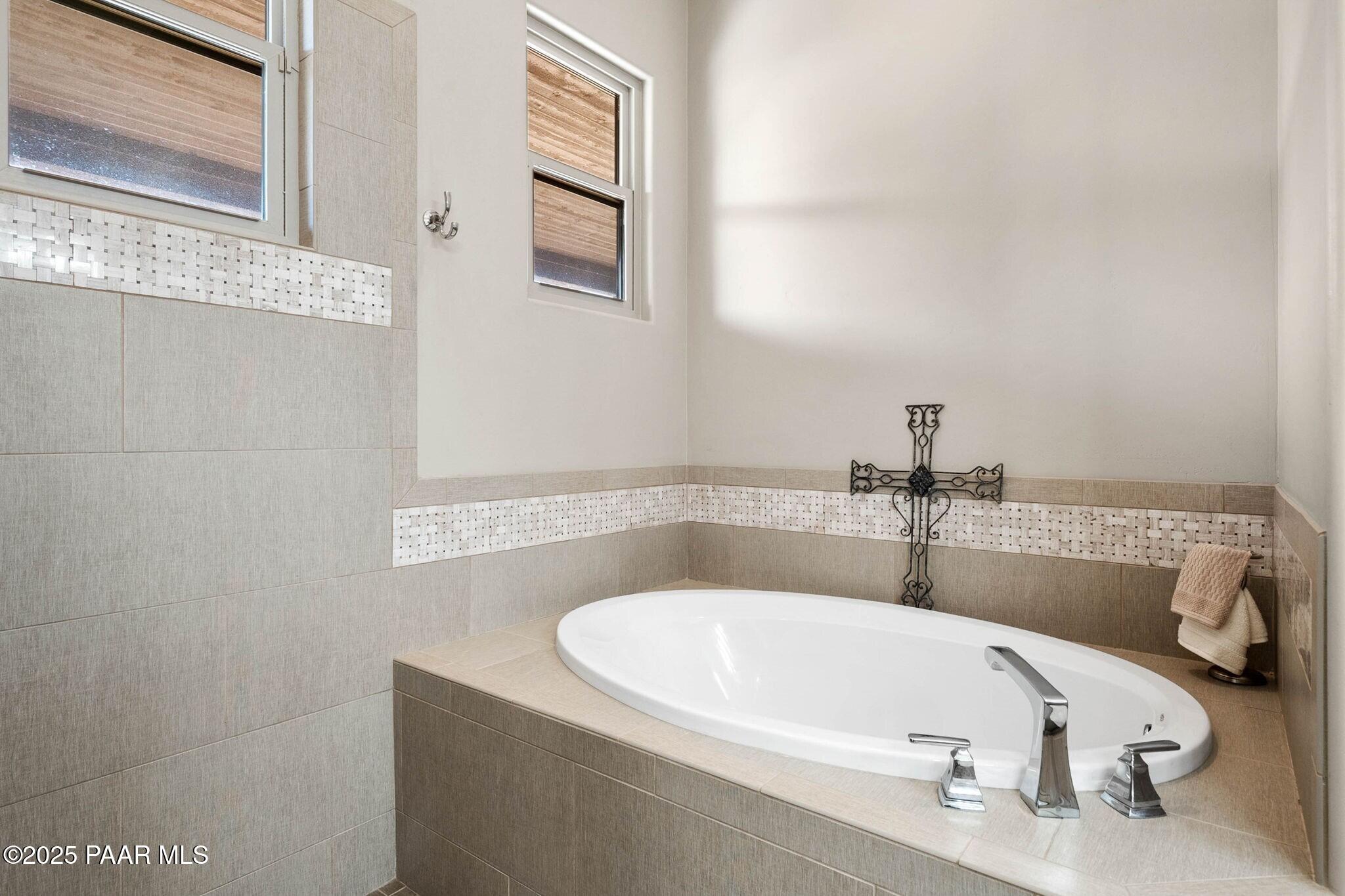 9309 North Callahan Road Prescott, AZ 86305 - Photo 19 of 55 a white bath tub sitting in a bathroom