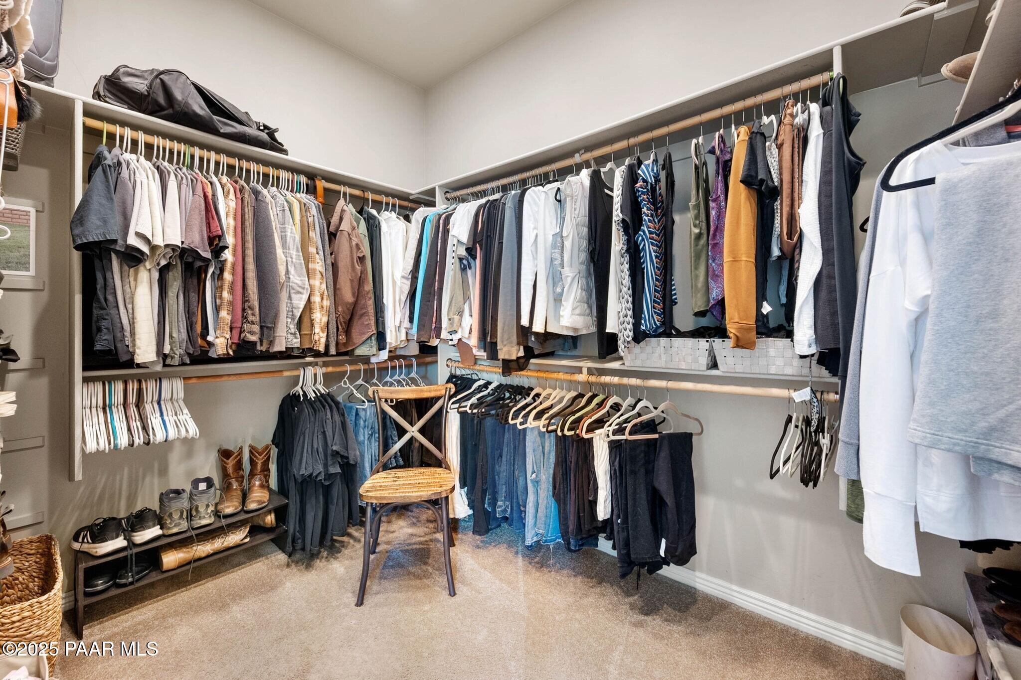 9309 North Callahan Road Prescott, AZ 86305 - Photo 20 of 55 a view of walk in closet with clothes and shoes