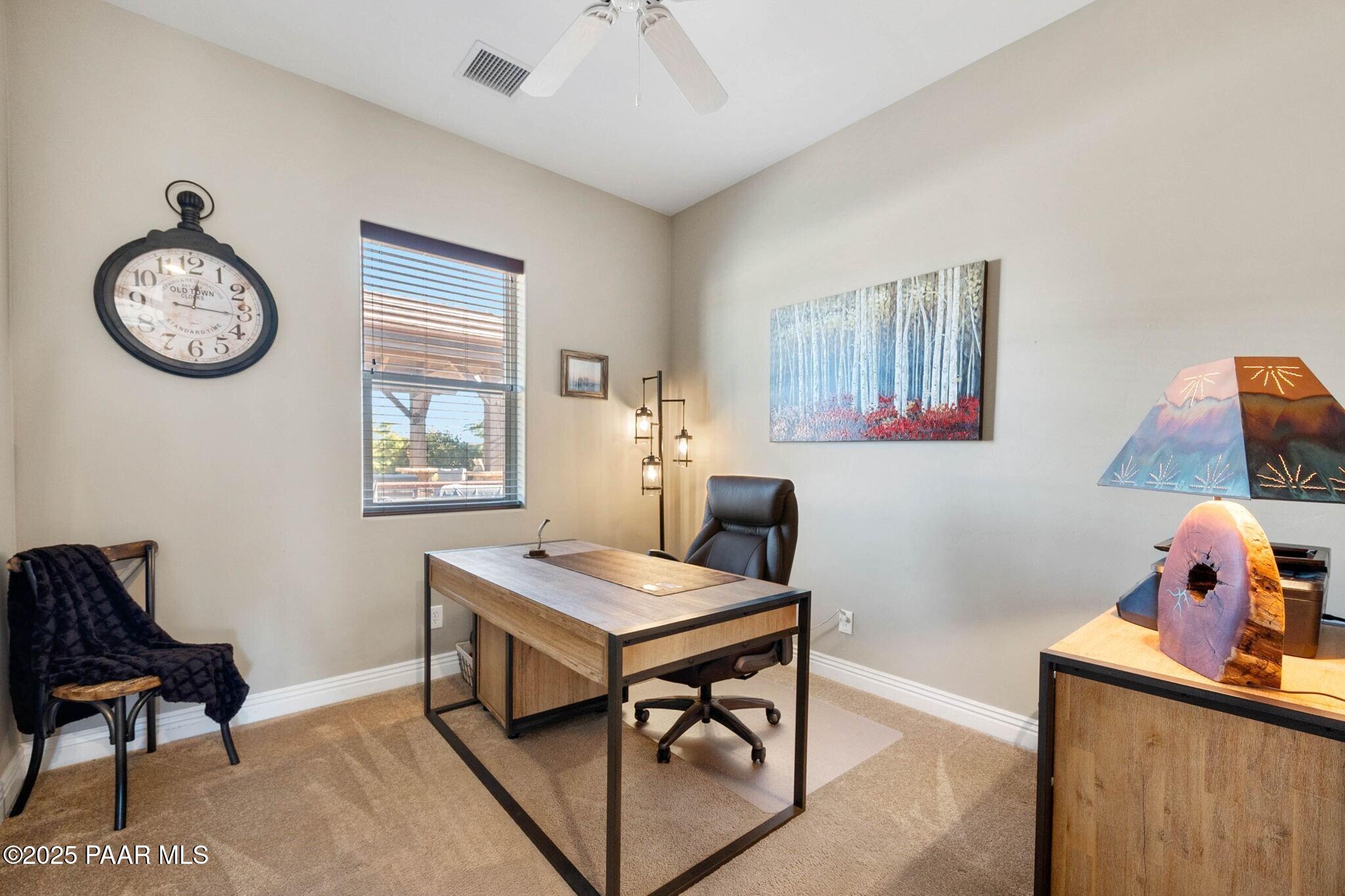 9309 North Callahan Road Prescott, AZ 86305 - Photo 21 of 55 a view of a workspace with furniture and a window
