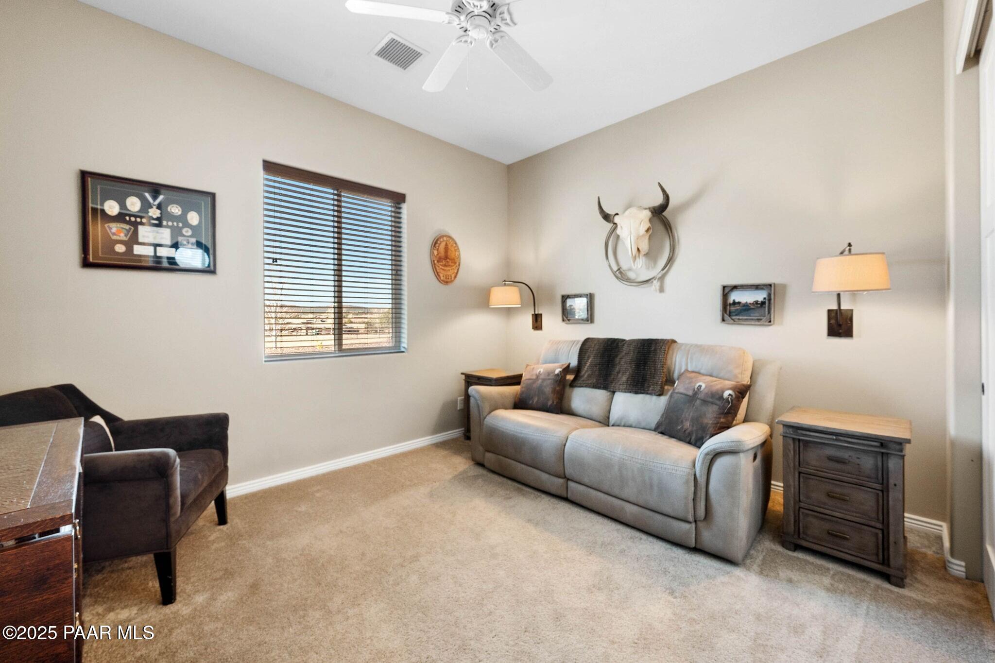 9309 North Callahan Road Prescott, AZ 86305 - Photo 23 of 55 a living room with furniture and a window