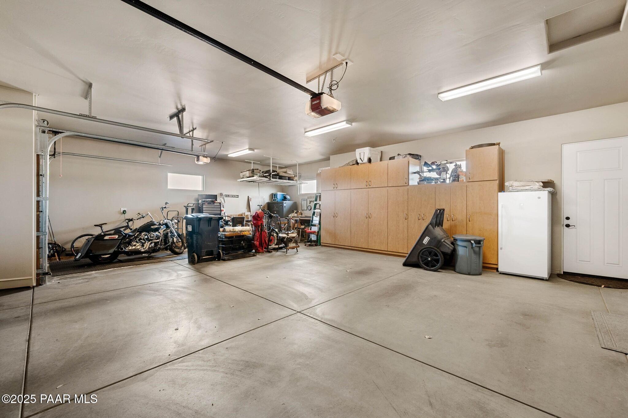 9309 North Callahan Road Prescott, AZ 86305 - Photo 28 of 55 a view of a garage with a bike and car