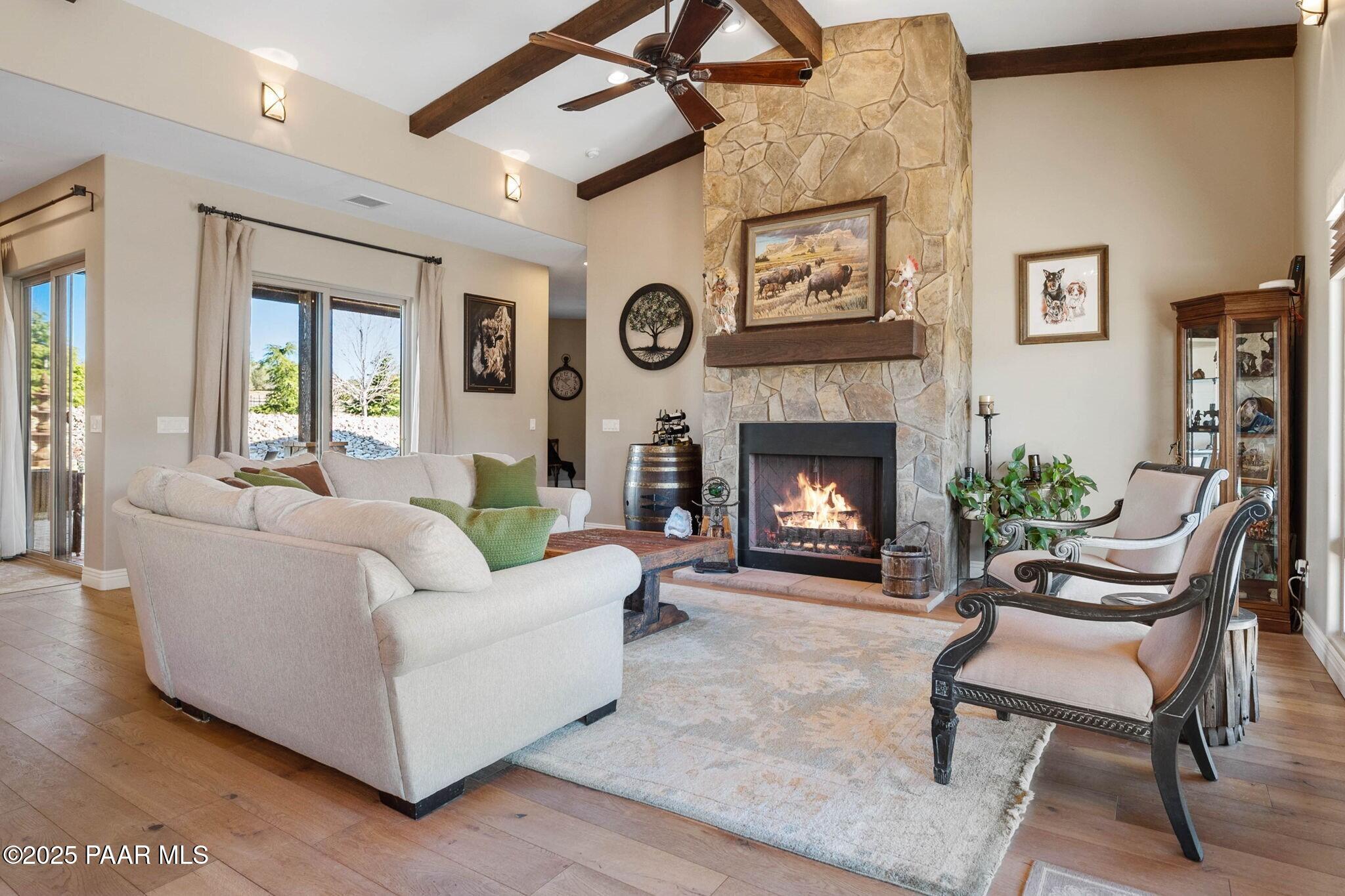 9309 North Callahan Road Prescott, AZ 86305 - Photo 3 of 55 a living room with furniture and a fireplace