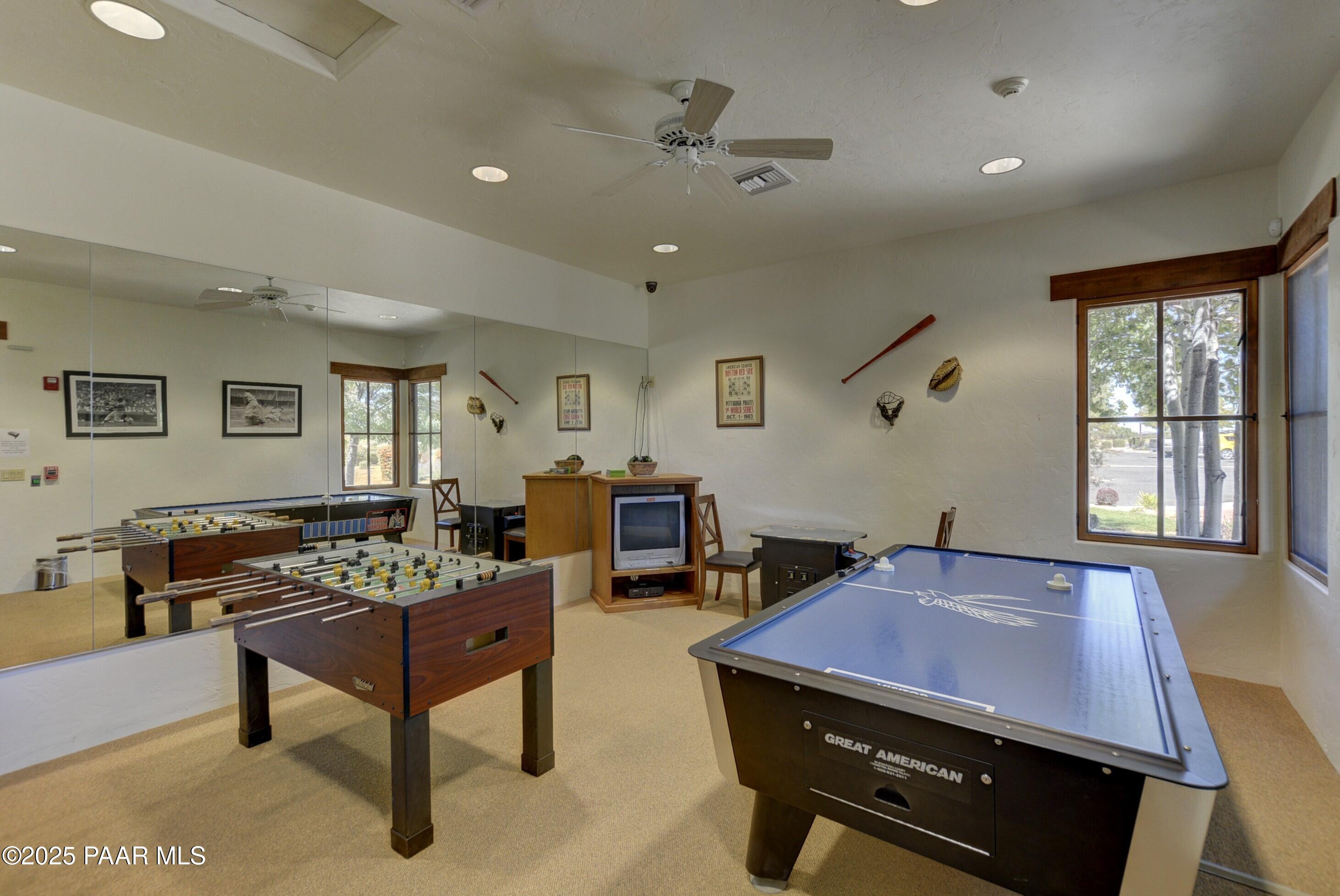9309 North Callahan Road Prescott, AZ 86305 - Photo 39 of 55 a living room with furniture a table and a large window
