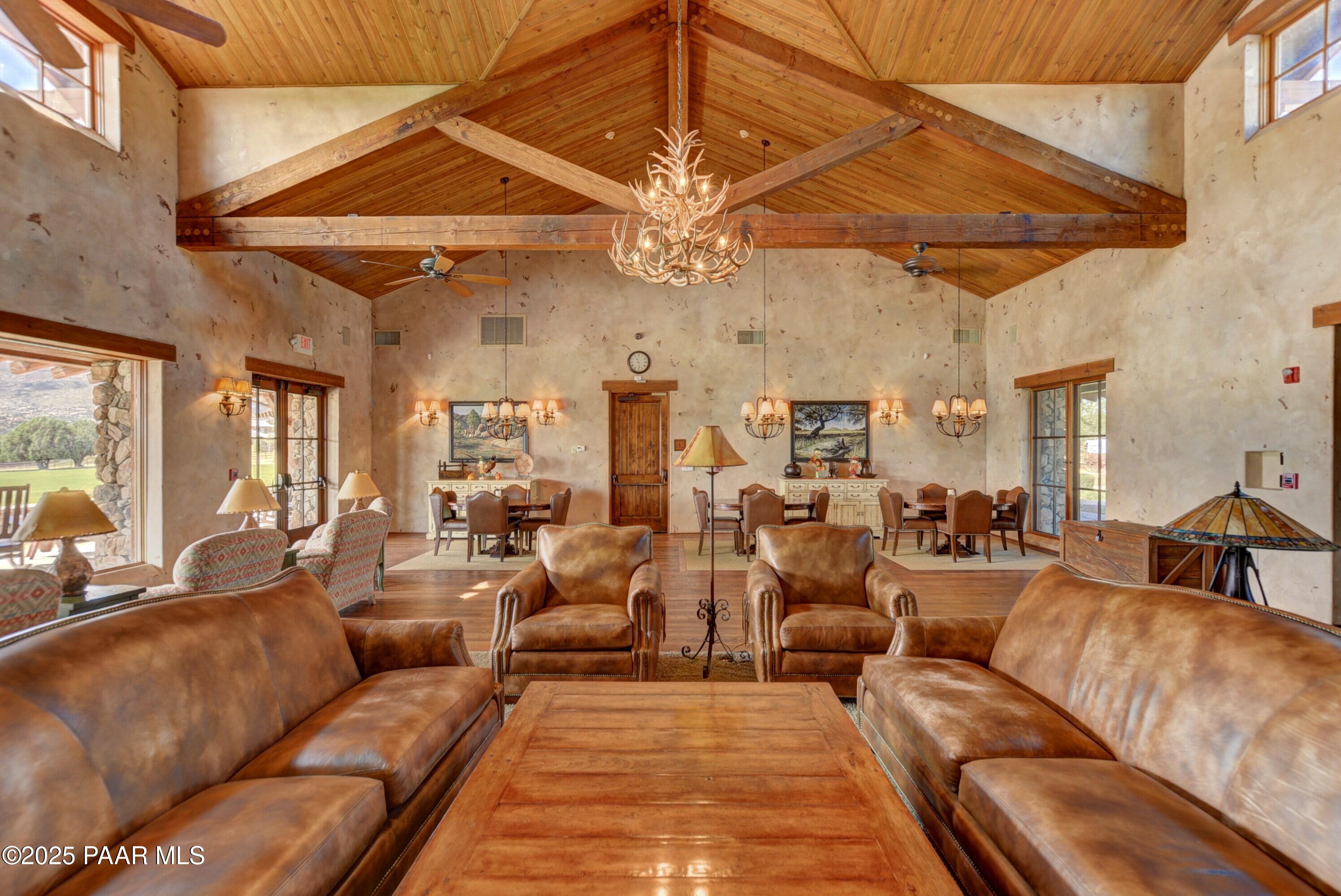 9309 North Callahan Road Prescott, AZ 86305 - Photo 42 of 55 a living room with furniture and a chandelier