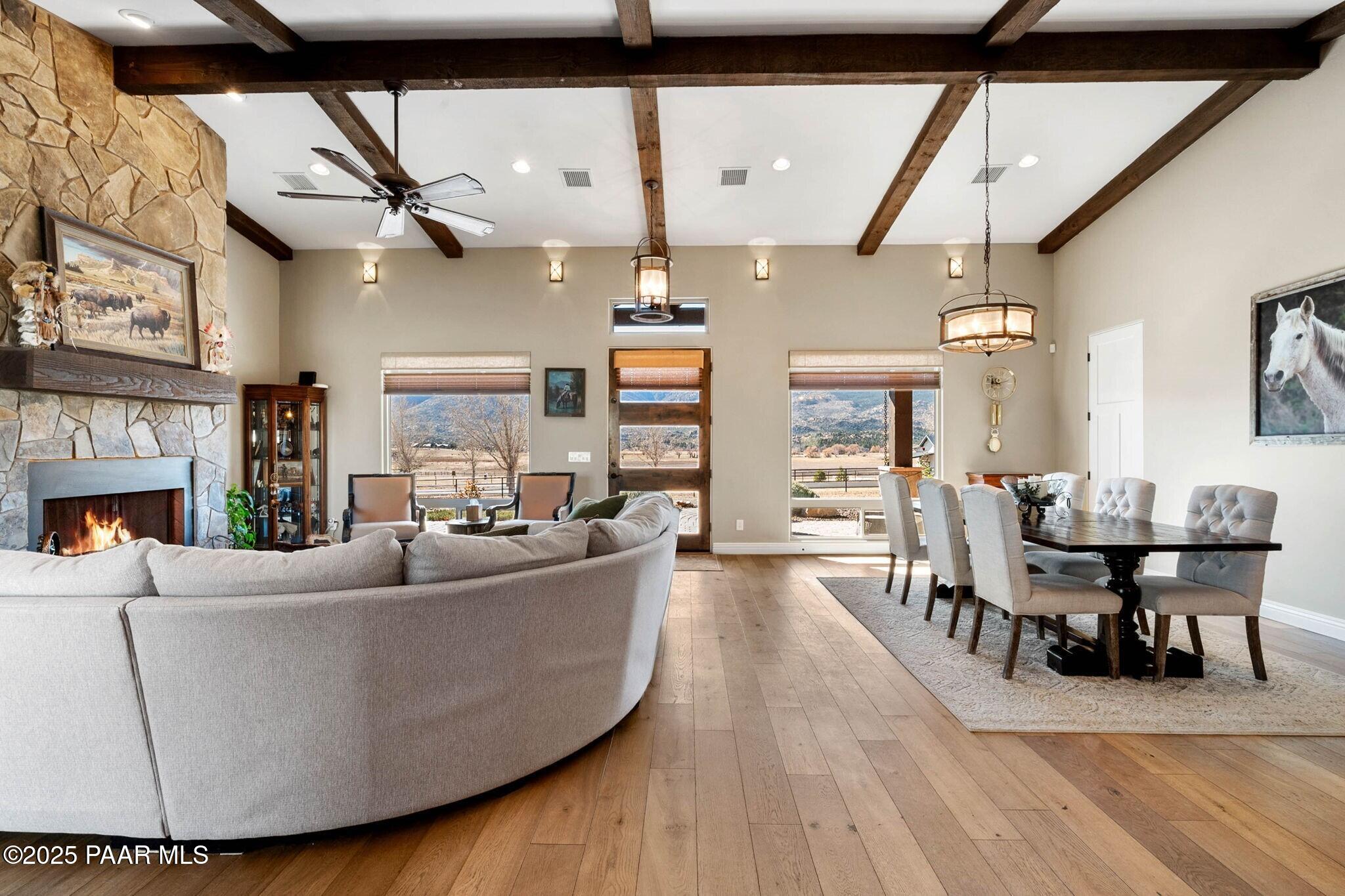 9309 North Callahan Road Prescott, AZ 86305 - Photo 9 of 55 a living room with furniture a fireplace and a flat screen tv