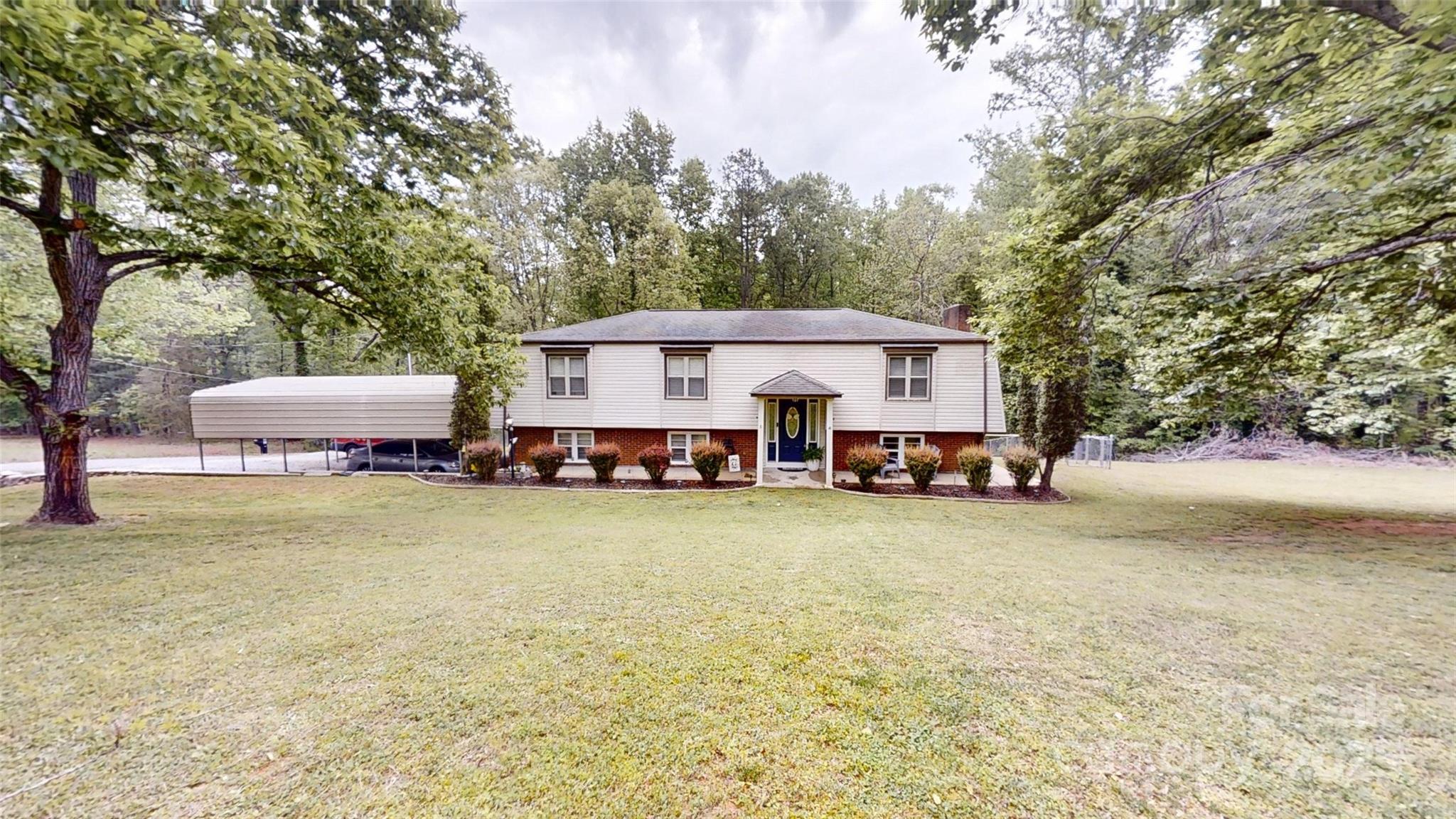 3816 Redman Road Shelby, NC 28150 - Photo 1 of 39 a view of a house with a yard and sitting area
