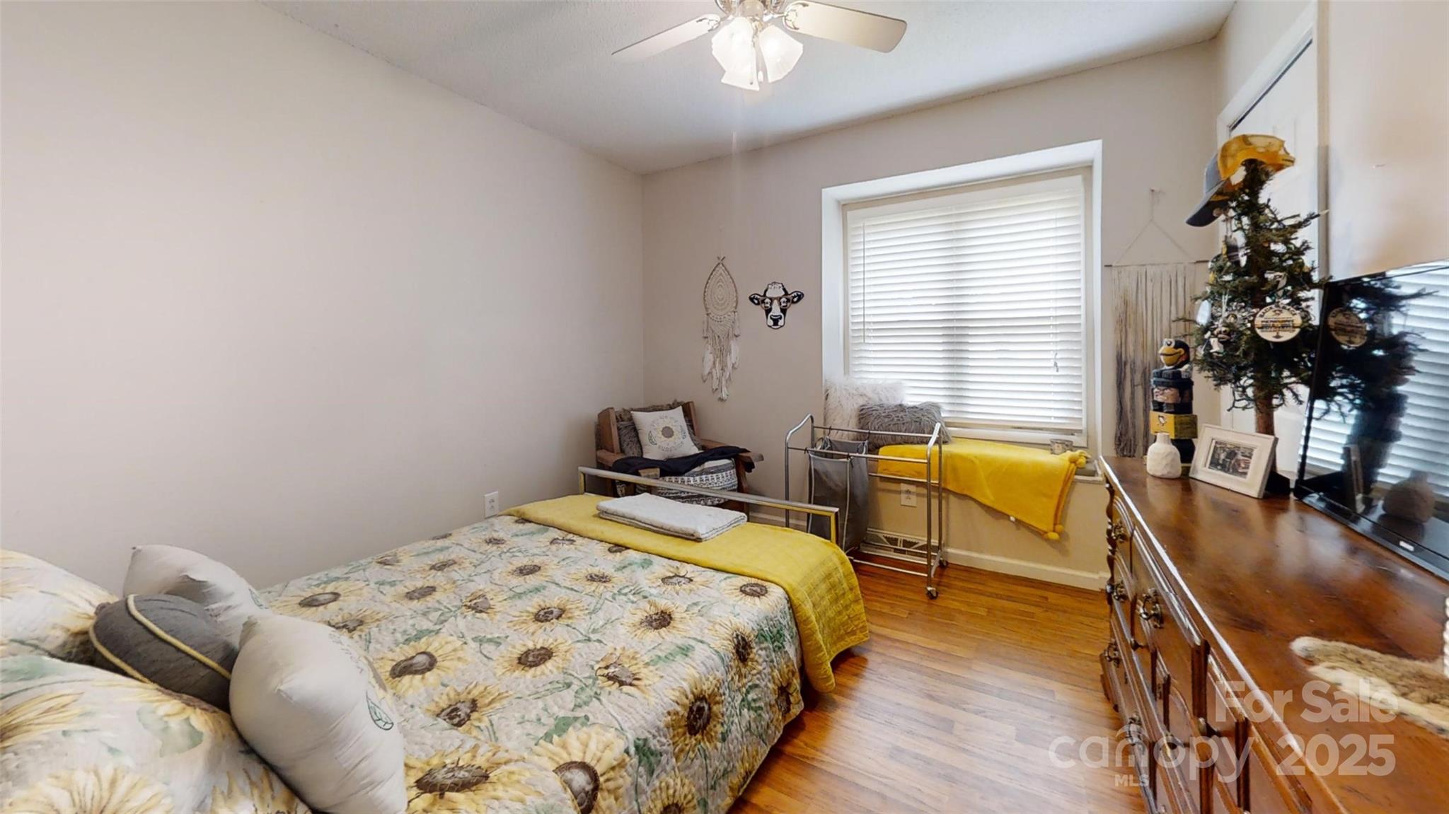 3816 Redman Road Shelby, NC 28150 - Photo 13 of 39 a bedroom with a bed and wooden floor