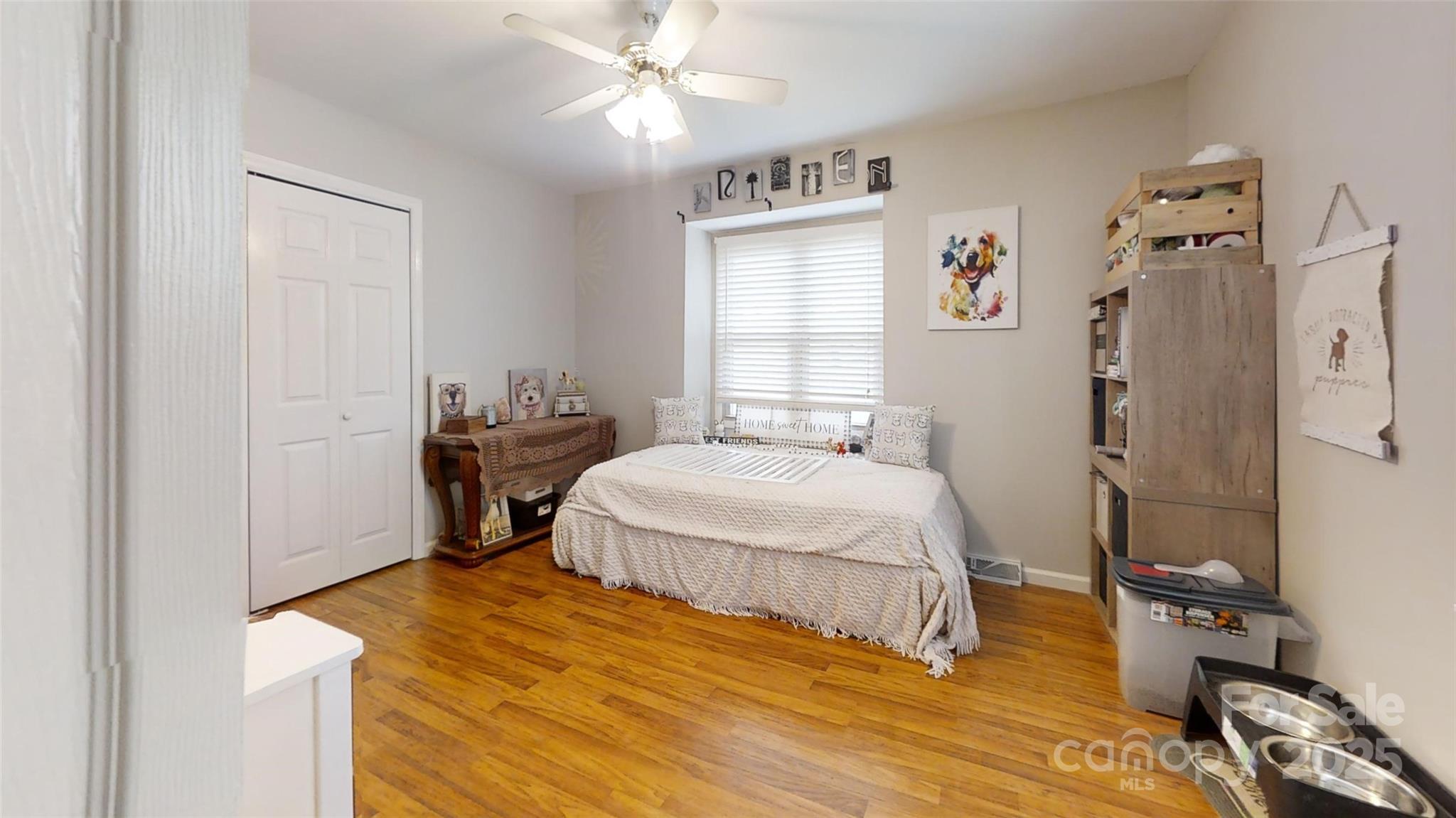 3816 Redman Road Shelby, NC 28150 - Photo 18 of 39 a bedroom with a bed and wooden floor