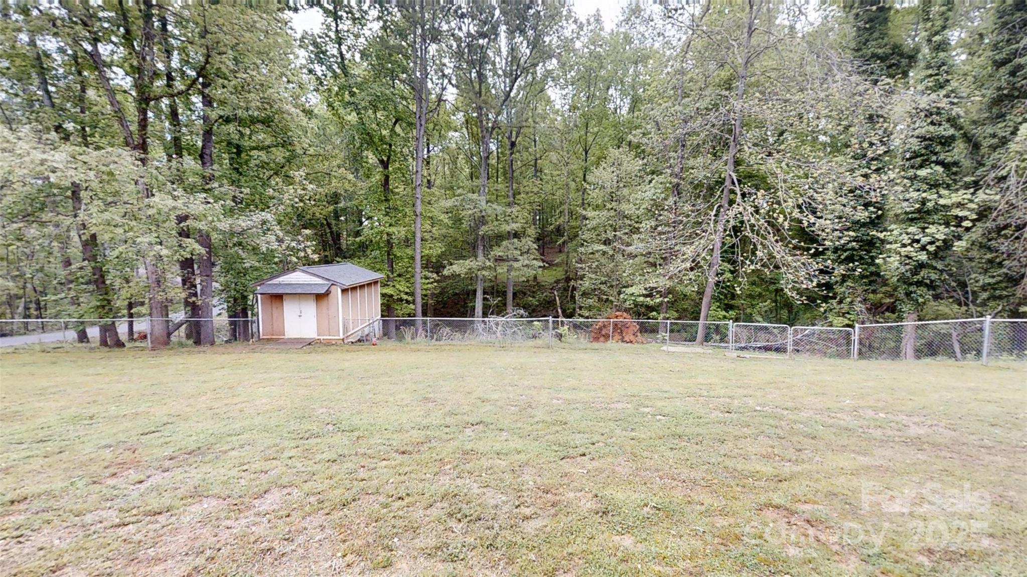 3816 Redman Road Shelby, NC 28150 - Photo 39 of 39 a backyard of a house with trees