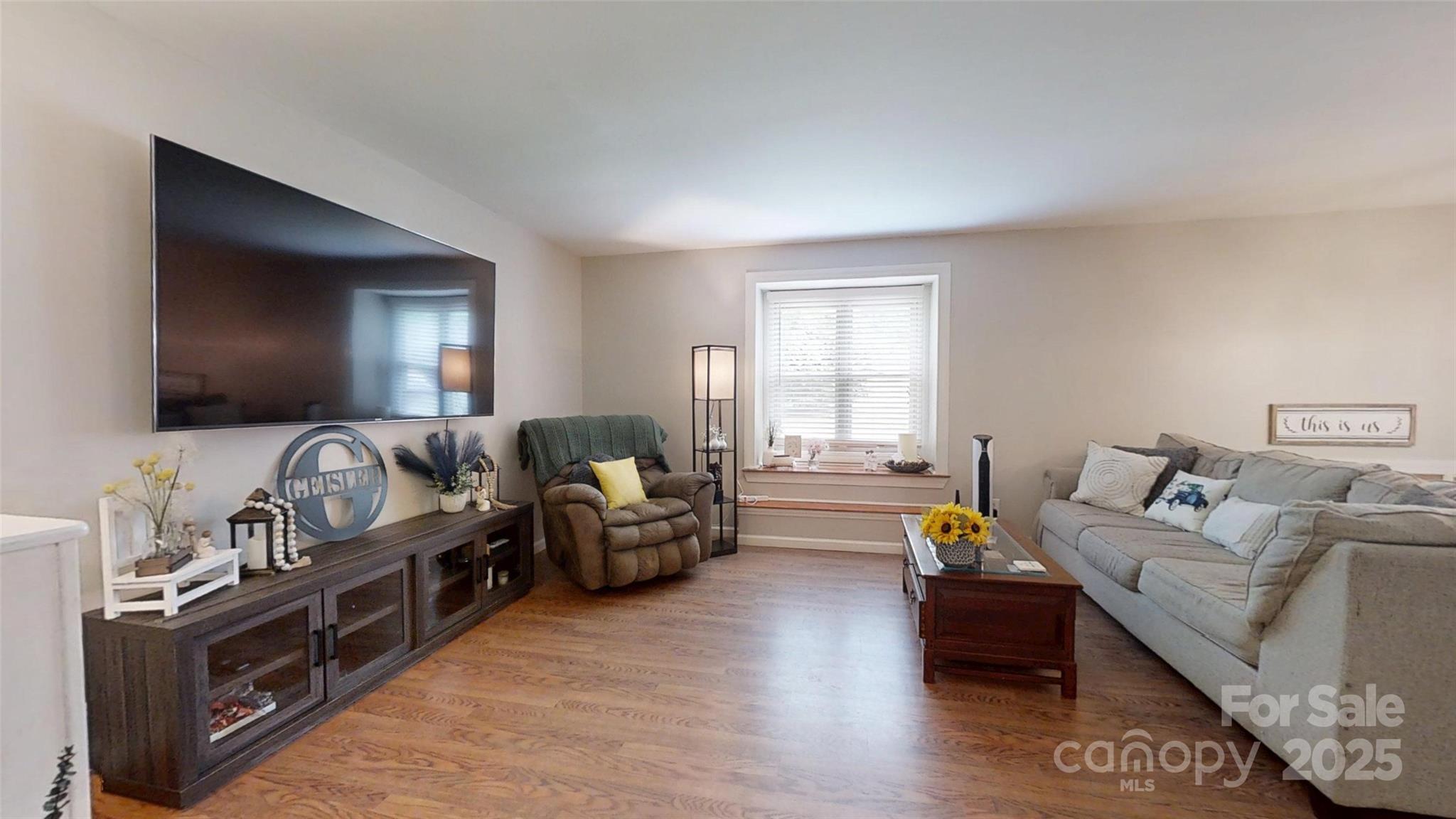3816 Redman Road Shelby, NC 28150 - Photo 7 of 39 a living room with furniture and a flat screen tv