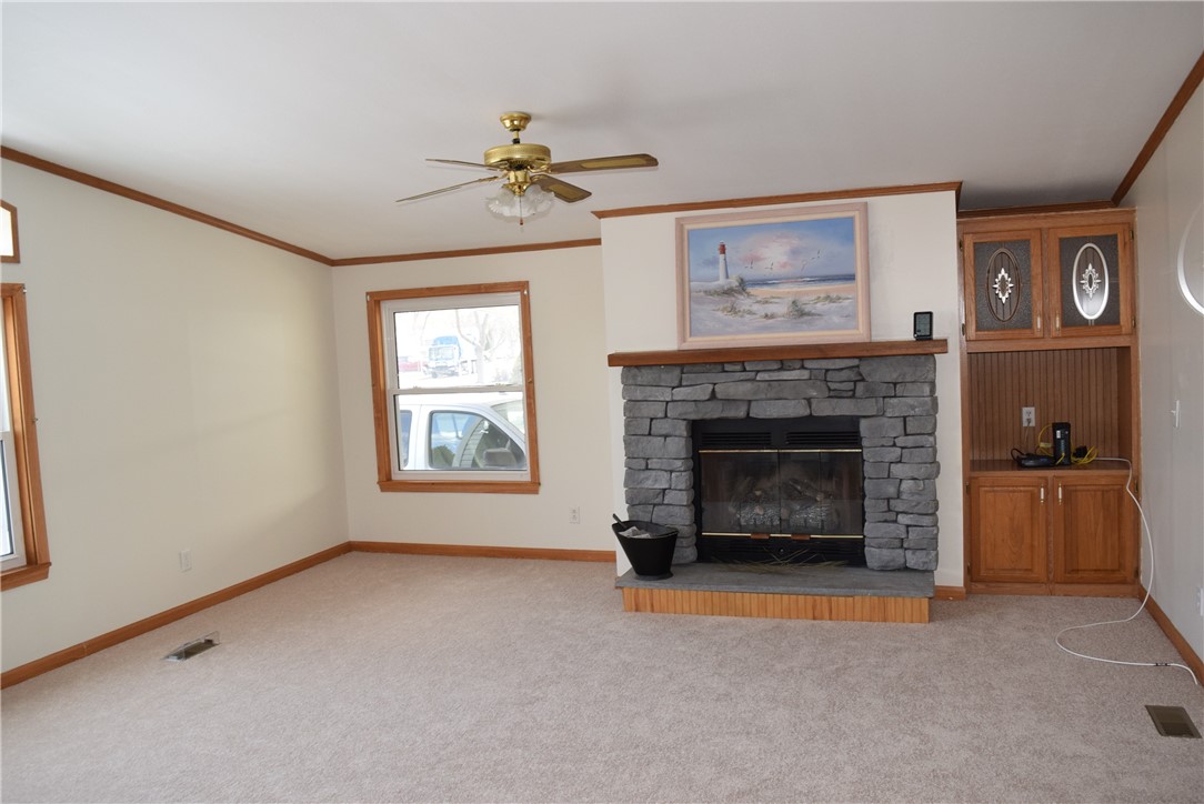 135 Heritage Estates Gaines, NY 14411 - Photo 2 of 18 Family Room w/gas fireplace