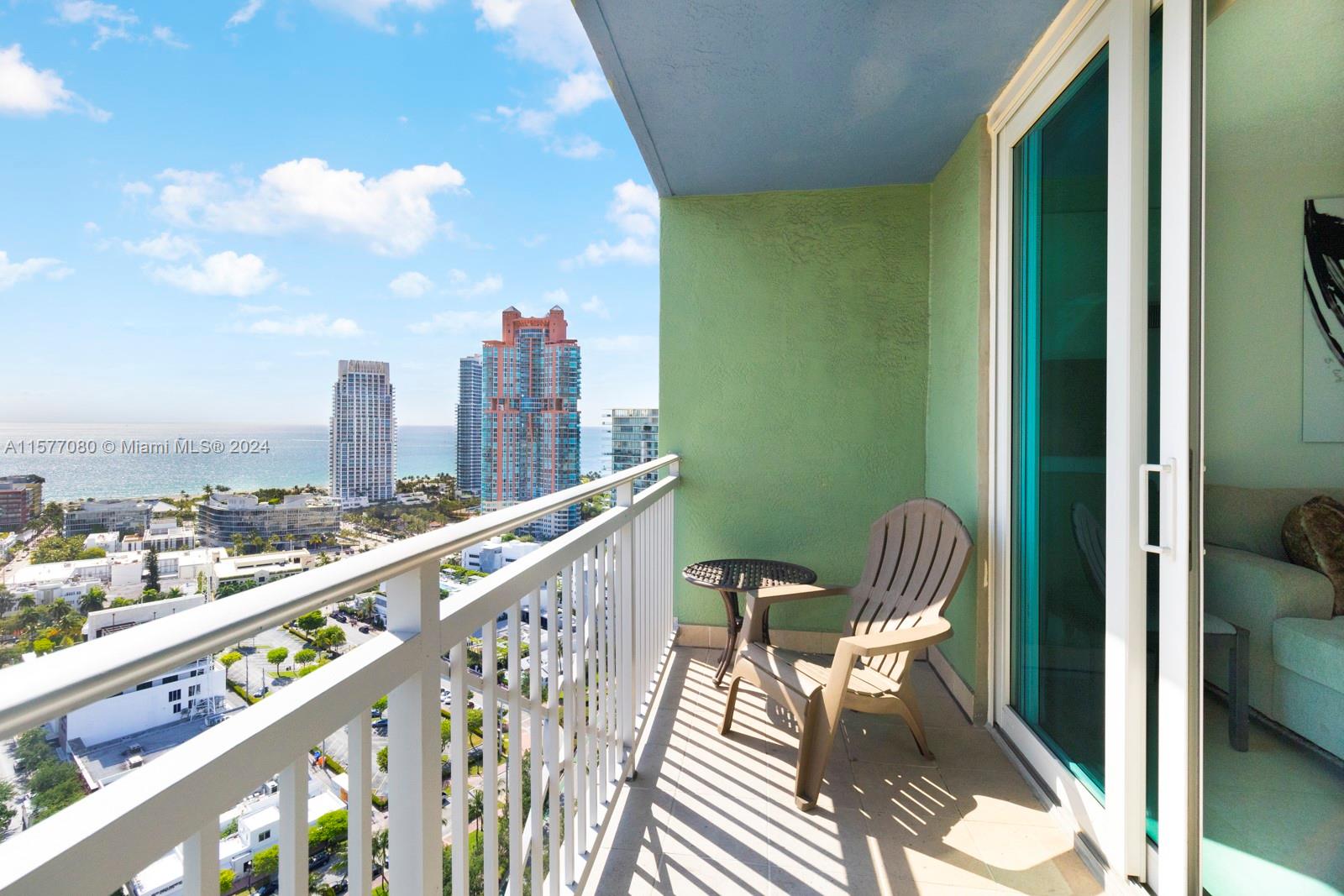 90 Alton Road, Unit 2907 Miami Beach, FL 33139 - Photo 5 of 18 a view of a chairs and table in balcony