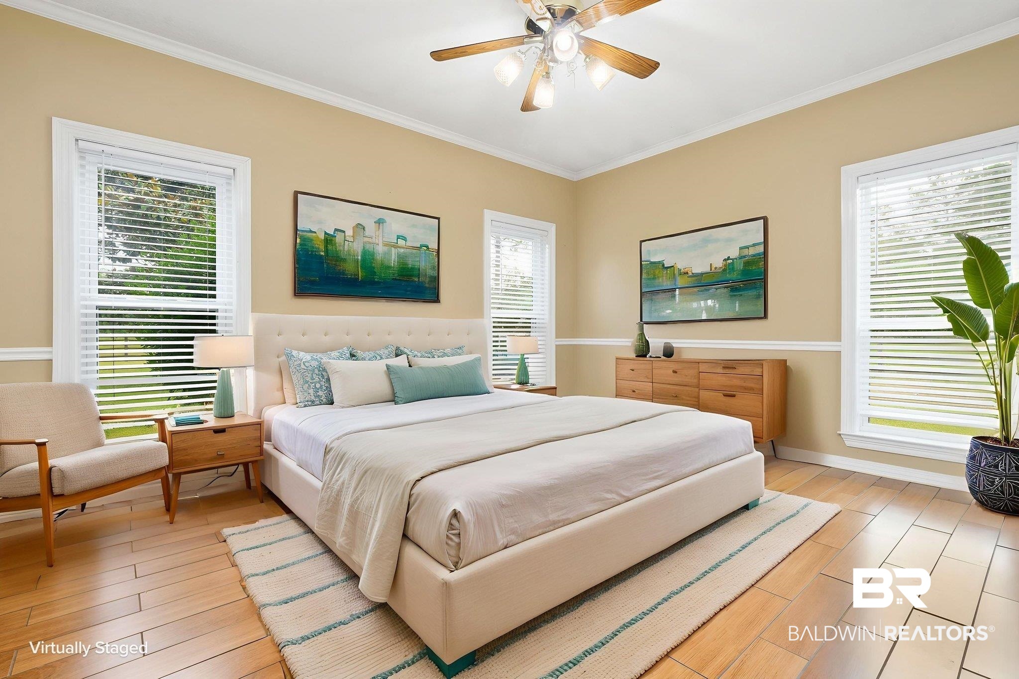 7540 2 Mile Road Irvington, AL 36544 - Photo 9 of 82 Spacious room featuring wood-finish flooring, crown molding, and a ceiling fan with integrated lighting