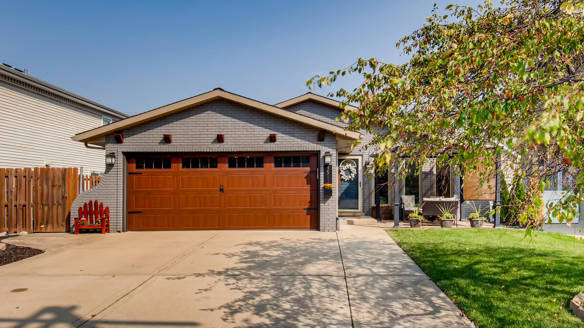 4511 Wolf Road Western Springs, IL 60558 - Photo 1 of 26 a front view of a house with a yard and garage