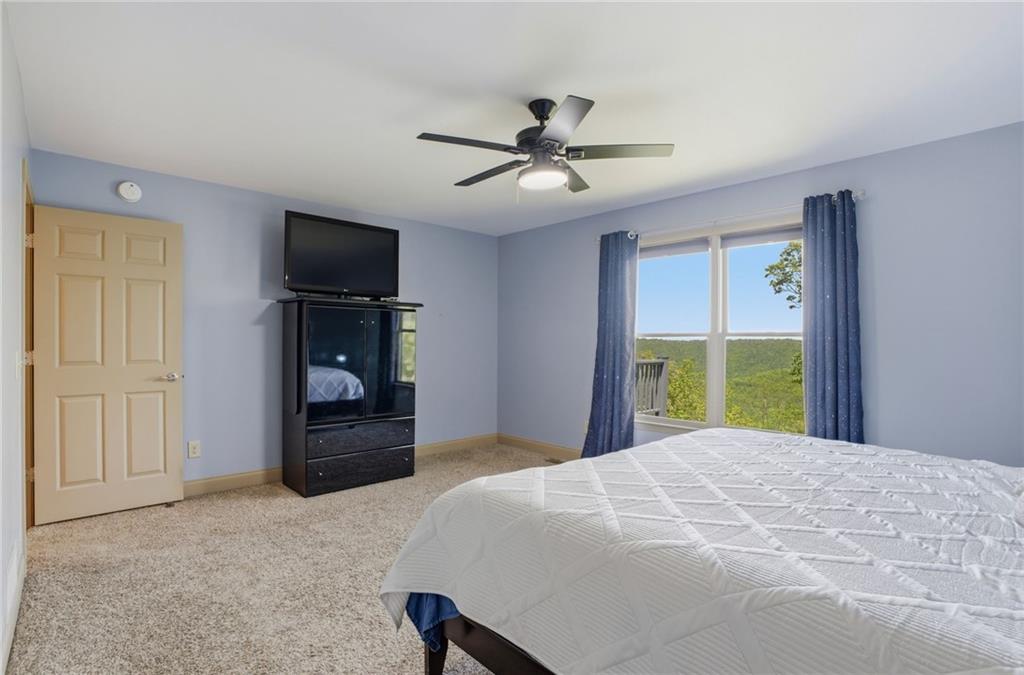 3326 Monument Road Jasper, GA 30143 - Photo 16 of 49 a bedroom with a bed and a flat screen tv