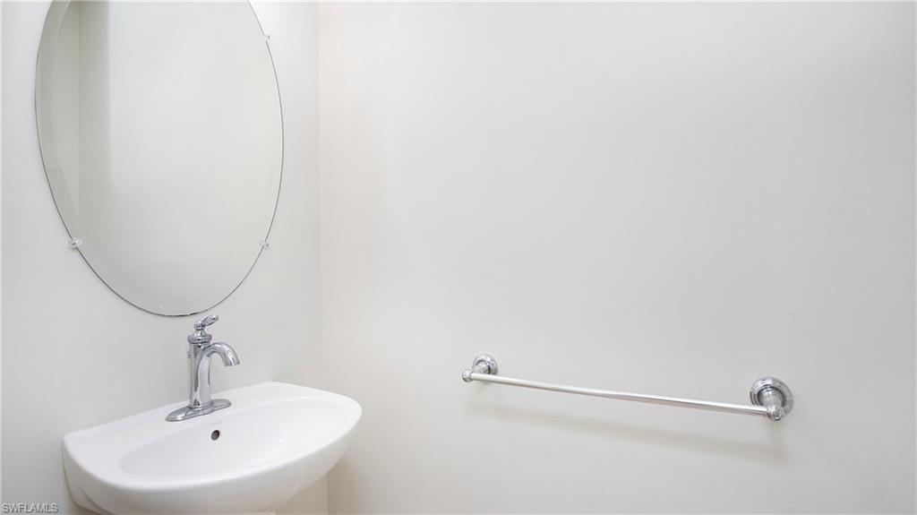 16149 Ravina Way, Unit 29 Naples, FL 34110 - Photo 20 of 39 Half Bathroom off kitchen