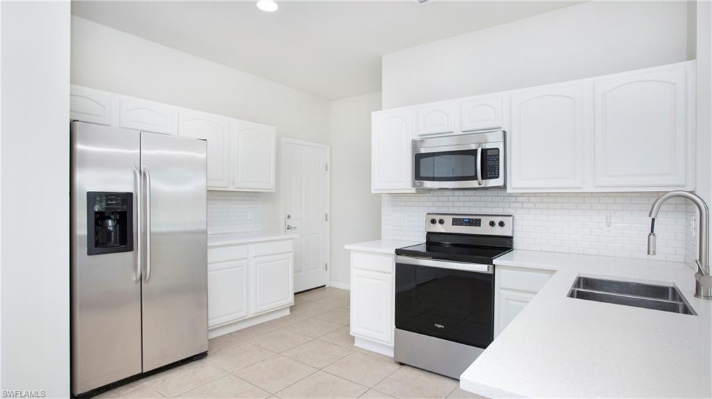 16149 Ravina Way, Unit 29 Naples, FL 34110 - Photo 9 of 39 Updated kitchen with stainless appliances