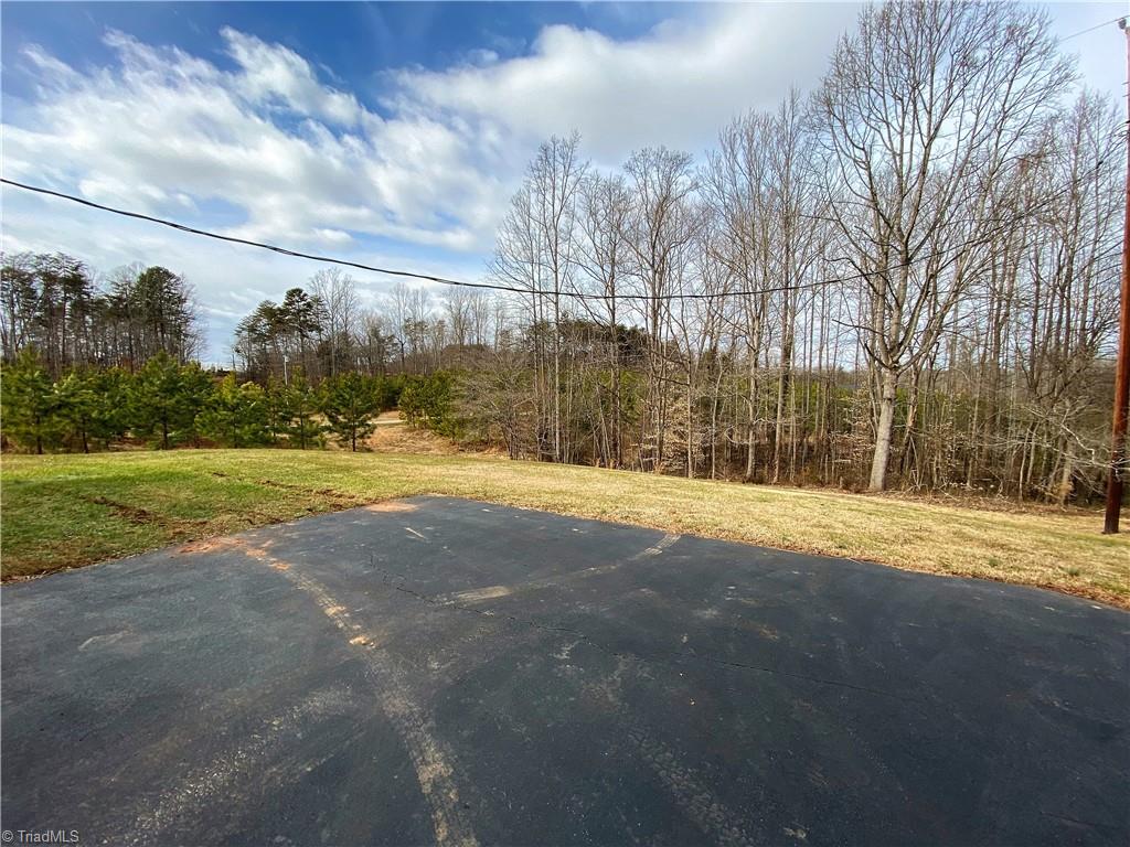 933 Lemons Road Stokesdale, NC 27357 - Photo 27 of 33 Additional view of paved parking area and back yard