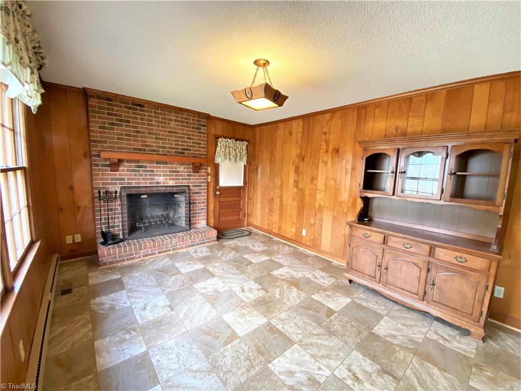 933 Lemons Road Stokesdale, NC 27357 - Photo 7 of 33 Den with wood burning fireplace
