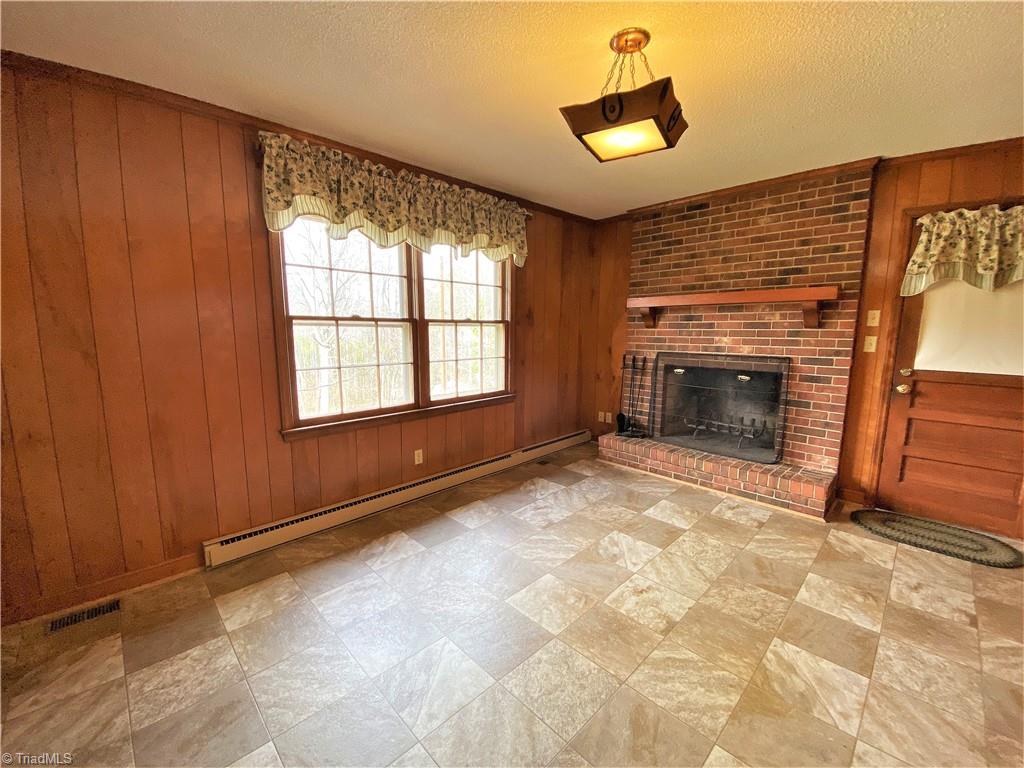 933 Lemons Road Stokesdale, NC 27357 - Photo 8 of 33 Additional view of den and dining area