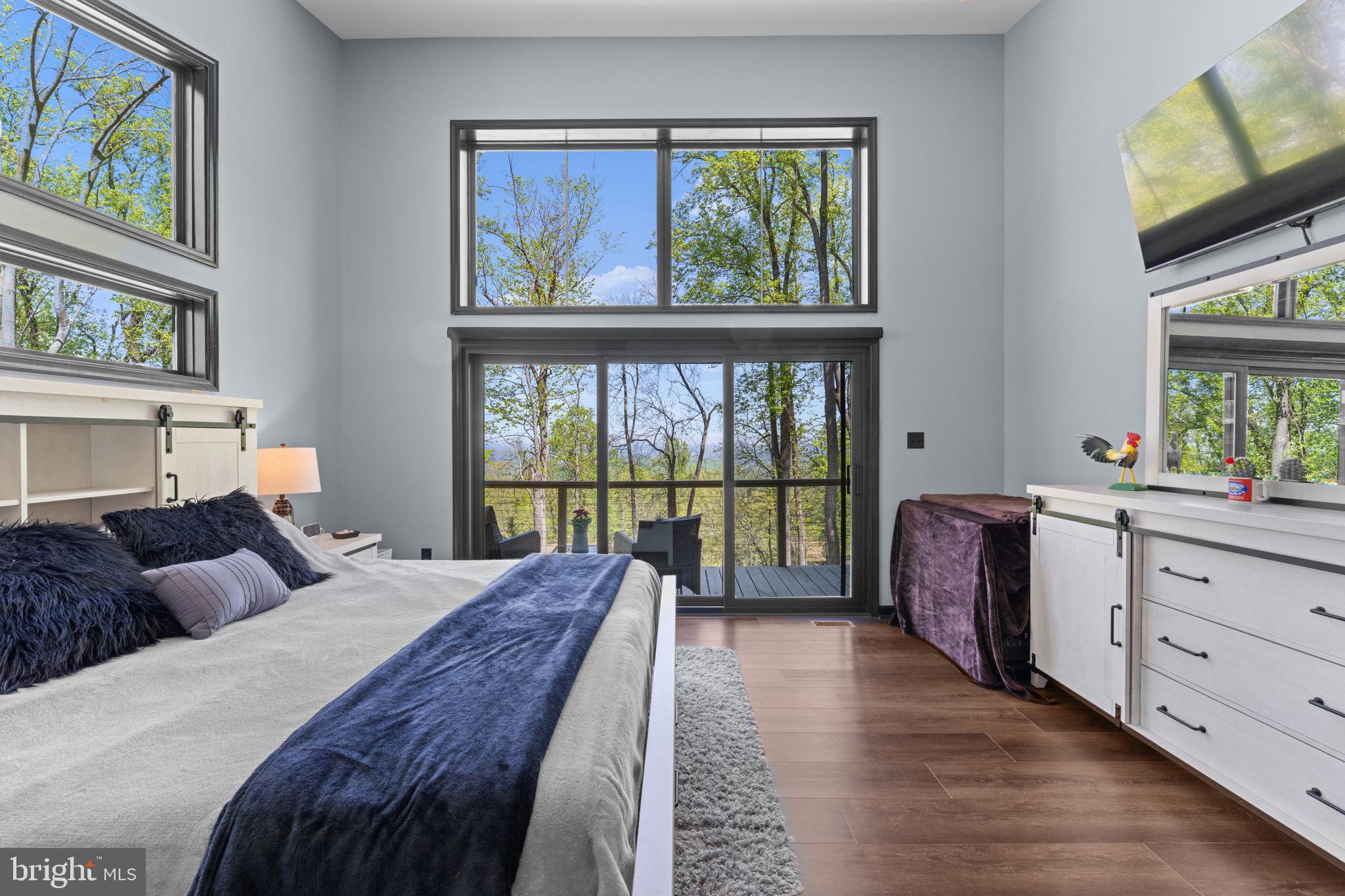 753 Club House Road Front Royal, VA 22630 - Photo 31 of 98 a bedroom with a large bed and a large window
