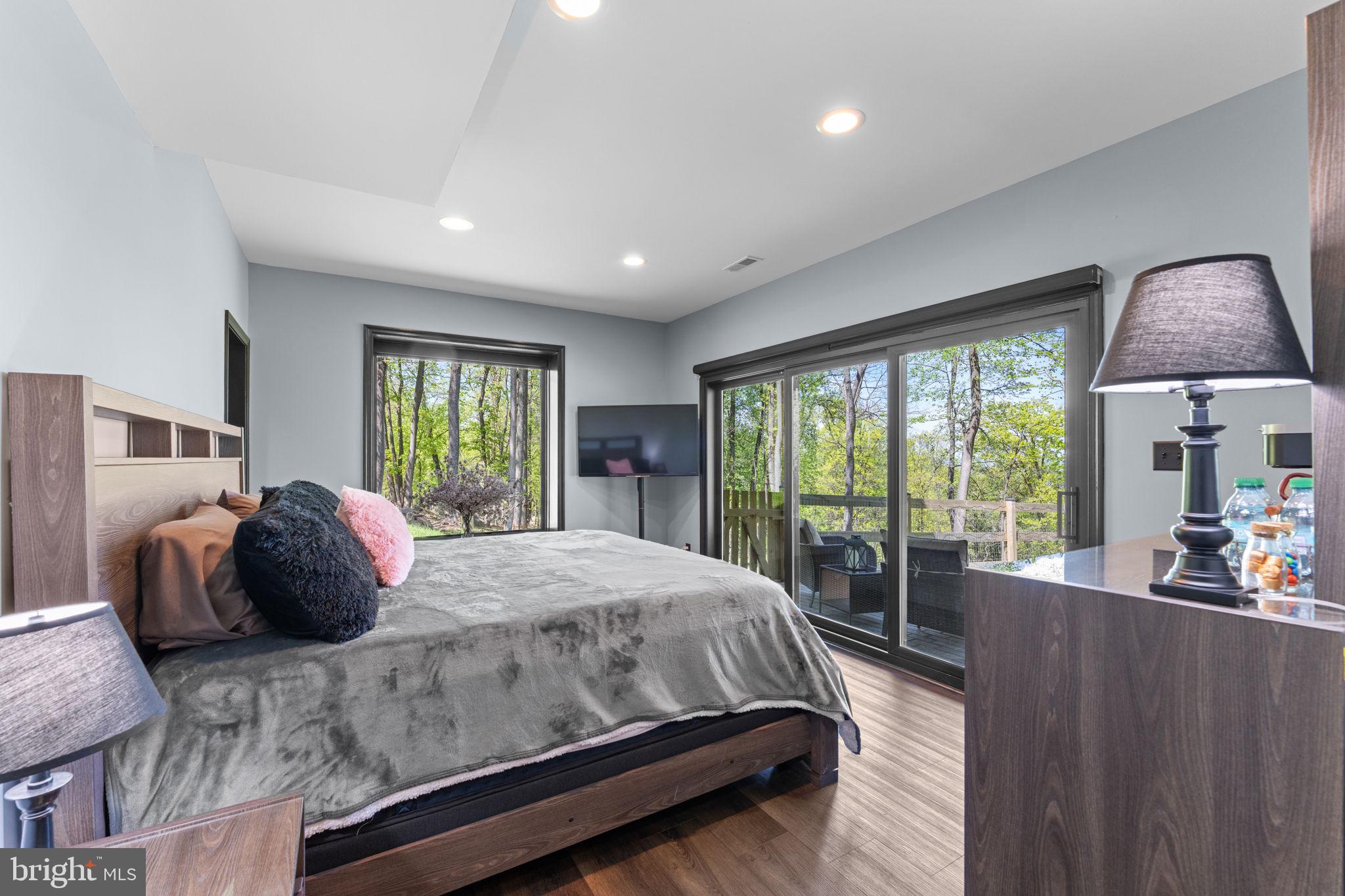 753 Club House Road Front Royal, VA 22630 - Photo 50 of 98 a bedroom with a large bed and a large window