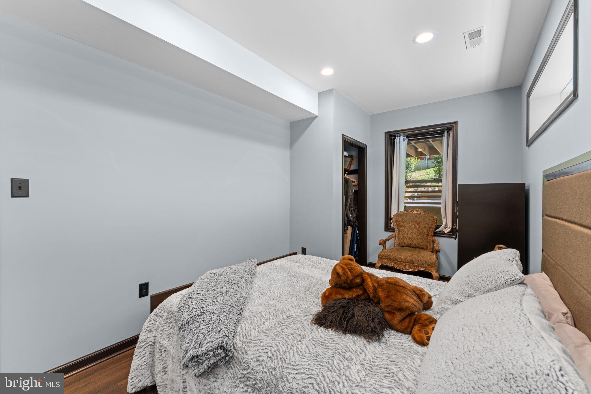 753 Club House Road Front Royal, VA 22630 - Photo 55 of 98 a bedroom with a bed and flat screen tv