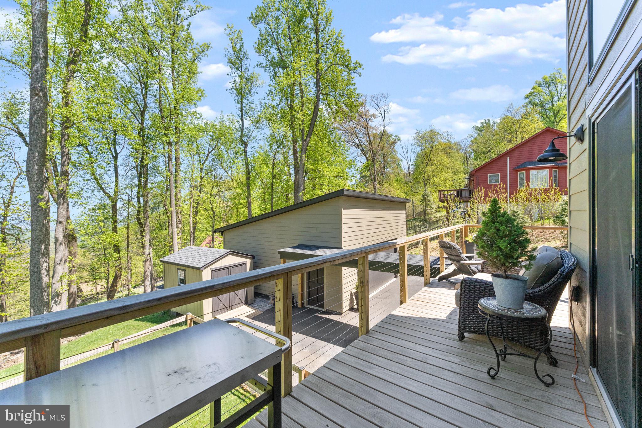 753 Club House Road Front Royal, VA 22630 - Photo 63 of 98 a balcony with wooden floor and outdoor seating