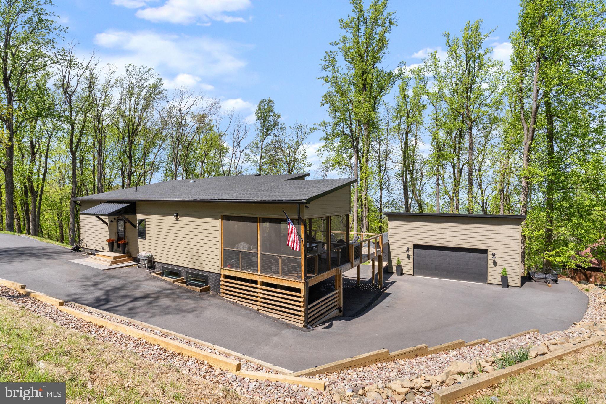 753 Club House Road Front Royal, VA 22630 - Photo 69 of 98 a view of house with outdoor space and trees around