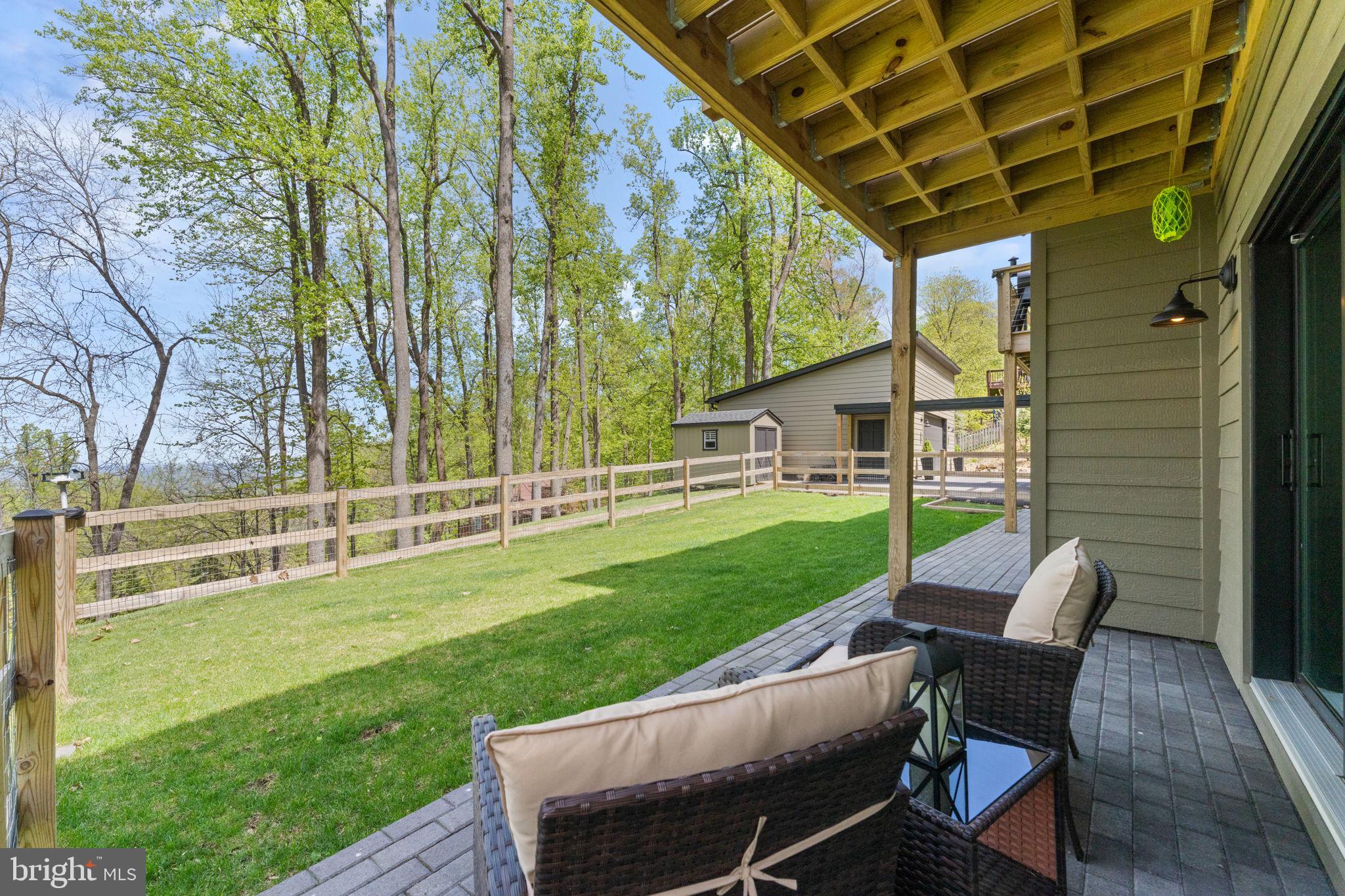 753 Club House Road Front Royal, VA 22630 - Photo 80 of 98 a view of a chair and table on the wooden deck