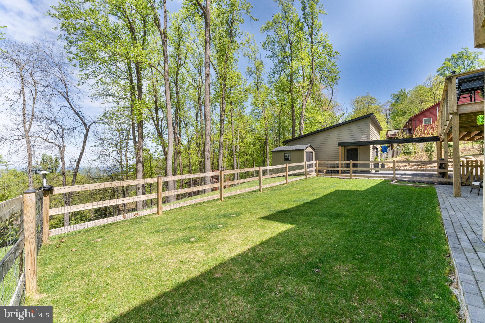 753 Club House Road Front Royal, VA 22630 - Photo 84 of 98 a view of a house with backyard and a tree